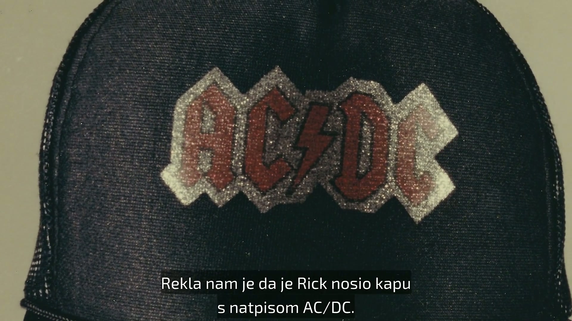 She told us that Rickwore a black AC/DC hat, wore a black Members Only ...