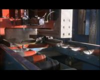 A SECOND PRESS CLAMPS THE DISK