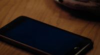 [cell phone buzzing]
