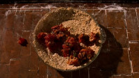 Lumpy oatmeal with fruitcake mashed in