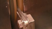 NEXT, WORKERS INSERT THE CUTTING PLIERS