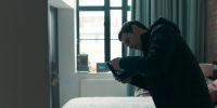 [phone buzzing]