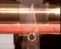 THAT THREAD GOES ONTO SPOOLS
