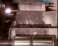 THEN IT CUTS THE CONTINUOUS LENGTHS WIDTHWISE