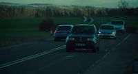 (traffic whooshing)