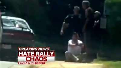 20-year-old, James
Fields, handcuffed at the scene. - White Noise