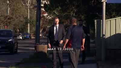 A 49-year-old
man led away in handcuffs - Never Let Him Go