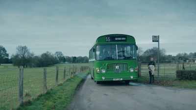 A blue van with a yellow ribbon - The Little Drummer Girl