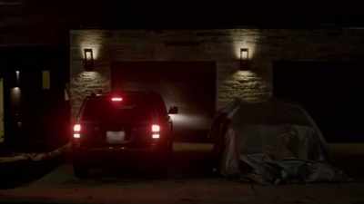 A car under a tarp. - Prank Encounters