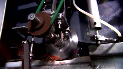 A CUTTER CHOPS OFF EACH BULB'S
TOP AND TAIL SIMULTANEOUSLY. - How It's Made