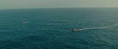 A cutting claw is placed
between the two boats. - Godzilla Minus One