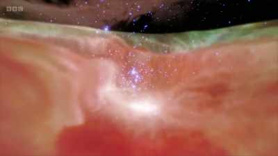 A dense molecular cloud
lit up by the stars it contains. - Secrets of Size: Atoms to Supergalaxies