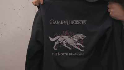 A direwolf on the back,
"The North Remembers." - Game of Thrones: The Last Watch