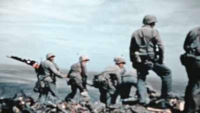 A few hours later, a
larger flag goes up. - The Pacific War in Color