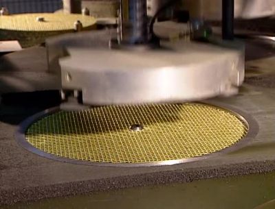 A HYDRAULIC PRESS
NOW COMPACTS THE MATERIAL, - How It's Made