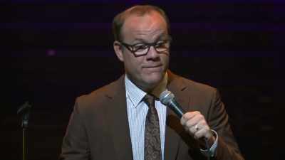 A man laying on his stomach - Tom Papa: Human Mule