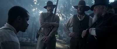 A nigger baptizing
a white man on my property! - The Birth of a Nation