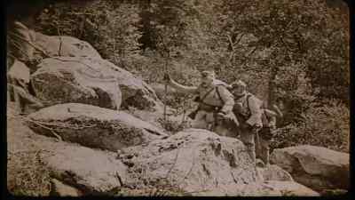 A platoon of soldiers on a
mapping expedition. - Blind Husbands