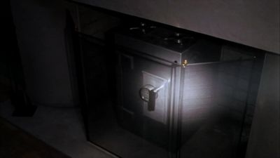 A safe in a fireplace. - Burn Notice
