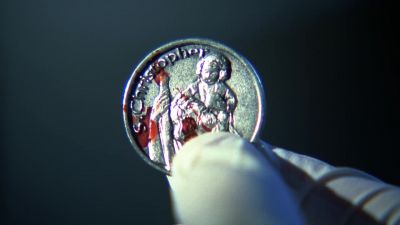 A Saint Christopher
medal with blood on it? - CSI: Crime Scene Investigation