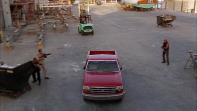A speeding truck
makes people scatter. - Burn Notice