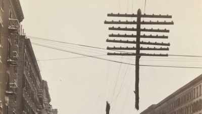 A telegraph pole ripped in half,
left dangling over the street. - Searching for Secrets