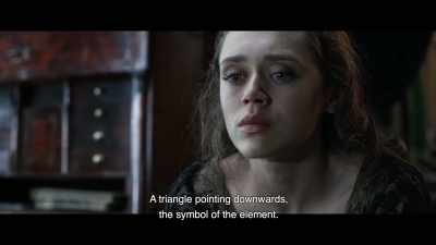 A triangle pointing downwards,
the symbol of the element. - The Ninth