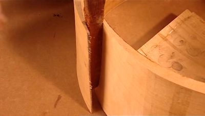 A WORKER PRIES APART THE ENDS... - How It's Made
