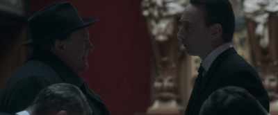 A young brunette, in an
ivory evening gown. - Maigret
