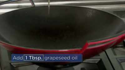 Add your grape-seed oil into the wok-- - Selena + Chef