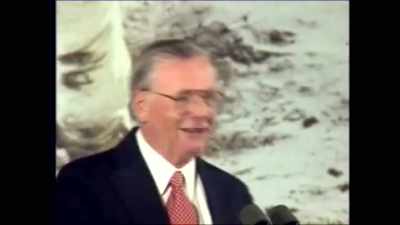 Addressing a group of students, - American Moon