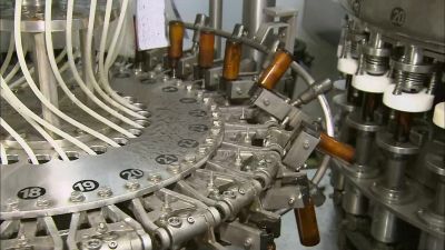 AFTER WASHING, THE BOTTLES
MOVE TO THE NEXT MACHINE - How It's Made