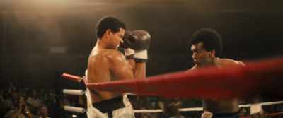 Ali retreating to the ropes, - Big George Foreman