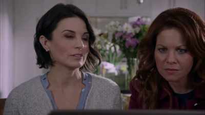 - "Alicia Minault, left,
and Melba Totino, right, - Dead Over Heels: An Aurora Teagarden Mystery