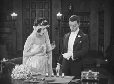 "All right -- let 'em be married in here
-- or down cellar -- or on the roof --" - The Saphead