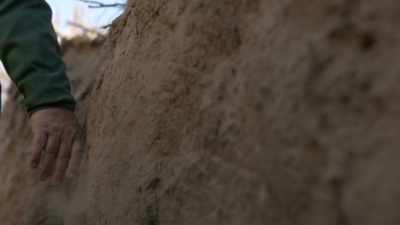 ALL THE WAY ALONG THIS ROCK
FACE, THERE ARE HEARTHS. - Origins: The Journey of Humankind