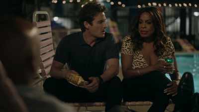 Although woman sitting alone
by a motel pool, - The Rookie: Feds