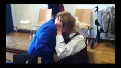 - An embrace between two people
is touching people - The Accountant of Auschwitz