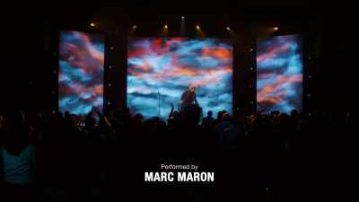 {\an8}♪ (CHEERFUL MUSIC PLAYING) ♪ - Marc Maron: From Bleak to Dark