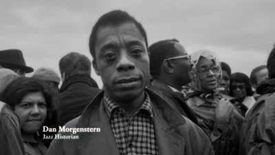 {\an8}I was with James Baldwin,
listening to Louis, - Louis Armstrong's Black & Blues