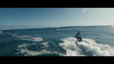 {\an8}[Jet Ski drones] - 100 Foot Wave