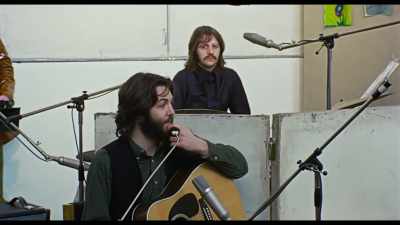 {\an8}Oh, sure, Albert Hall.
Sure. Five o'clock. See you there. - The Beatles: Get Back