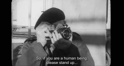 {\an8}So, if you are a human being,
please stand up... - Minamata