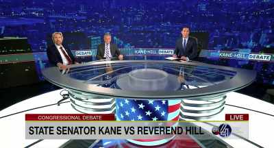 {\an8}Tonight State Senator
Peter Kane faces newcomer - God's Not Dead: In God We Trust