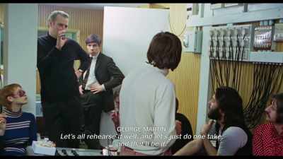 {\an8}Yeah, right. Now, see the thing is,
we need another week to do it. - The Beatles: Get Back