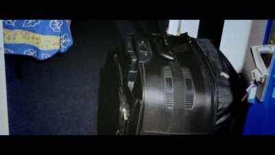 And they also find a locked suitcase. - The Puppet Master: Hunting the Ultimate Conman