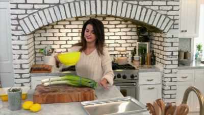 And so I'm trimming off the hairy end, - Selena + Chef