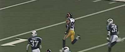 And Isaac Bruce
threads his way
for a touchdown! - American Underdog