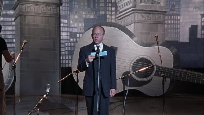 And now please join me in welcoming our next three talented performers - A Mighty Wind