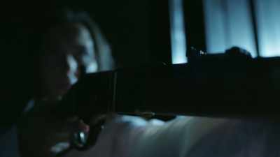 And she's armed with a rifle. - Famously Haunted: Amityville